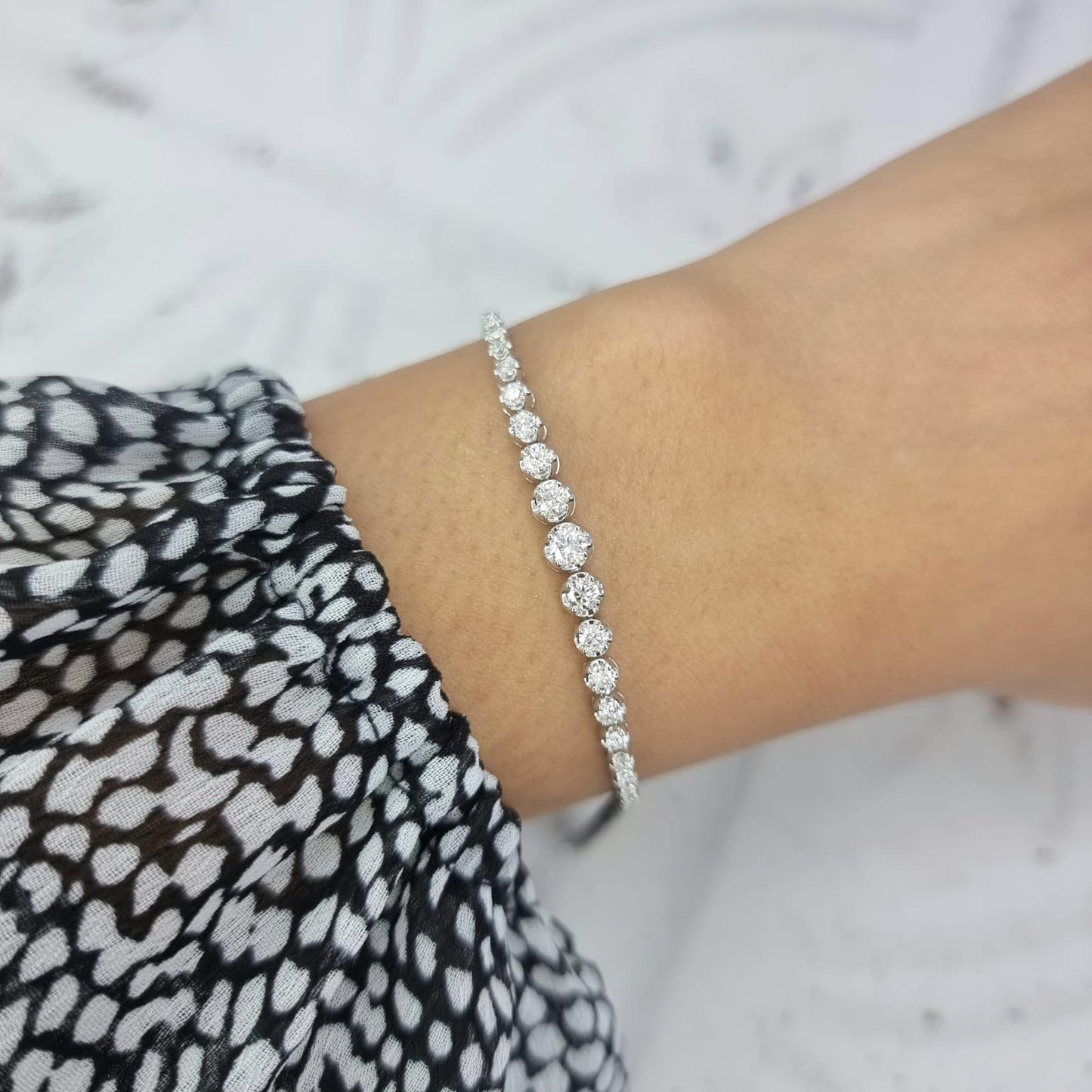 18CT White Gold graduated diamond line bracelet