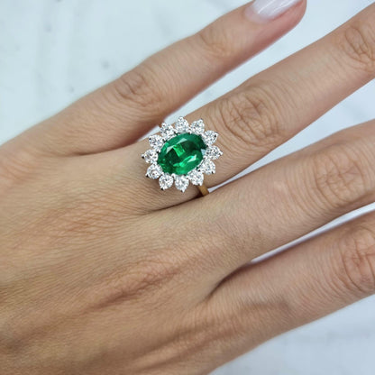 18CT GOLD OVAL EMERALD CLUSTER RING