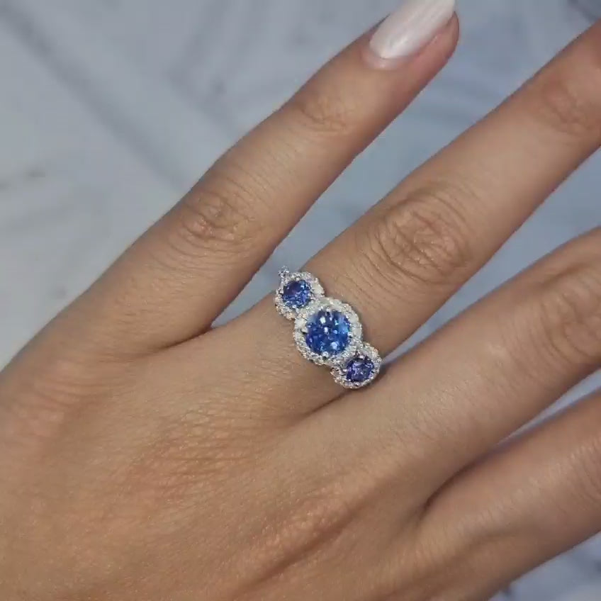 PLATINUM BLUE SAPPHIRE THREE STONE HALO RINGS